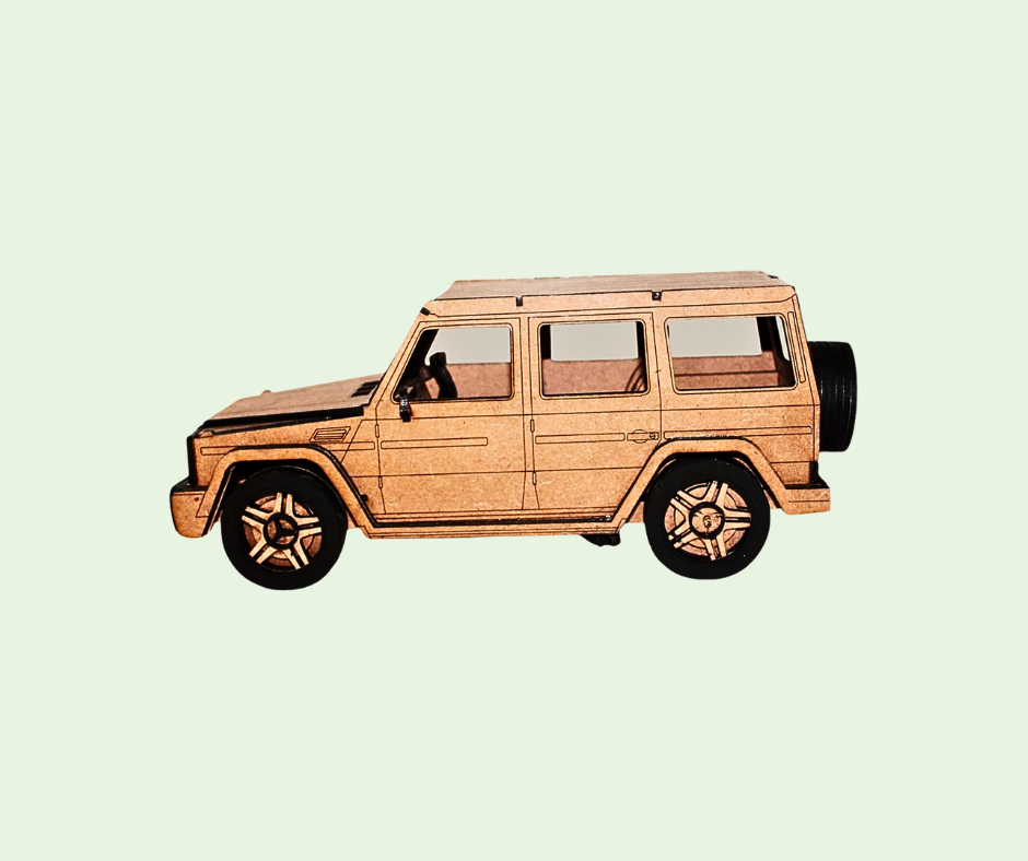 Wooden model of a vehicle on a light green background