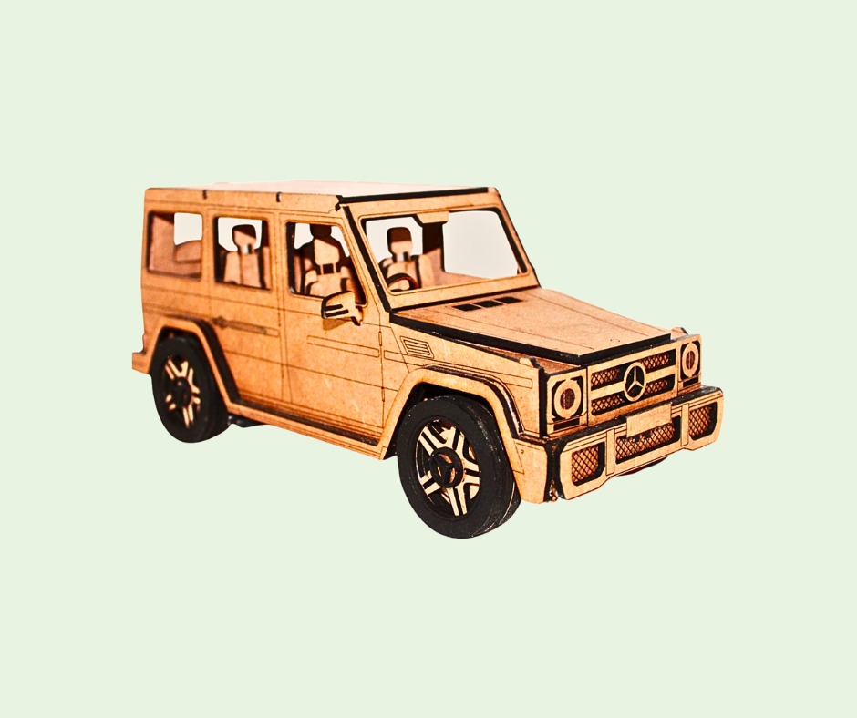 Wooden model of a car on a light green background