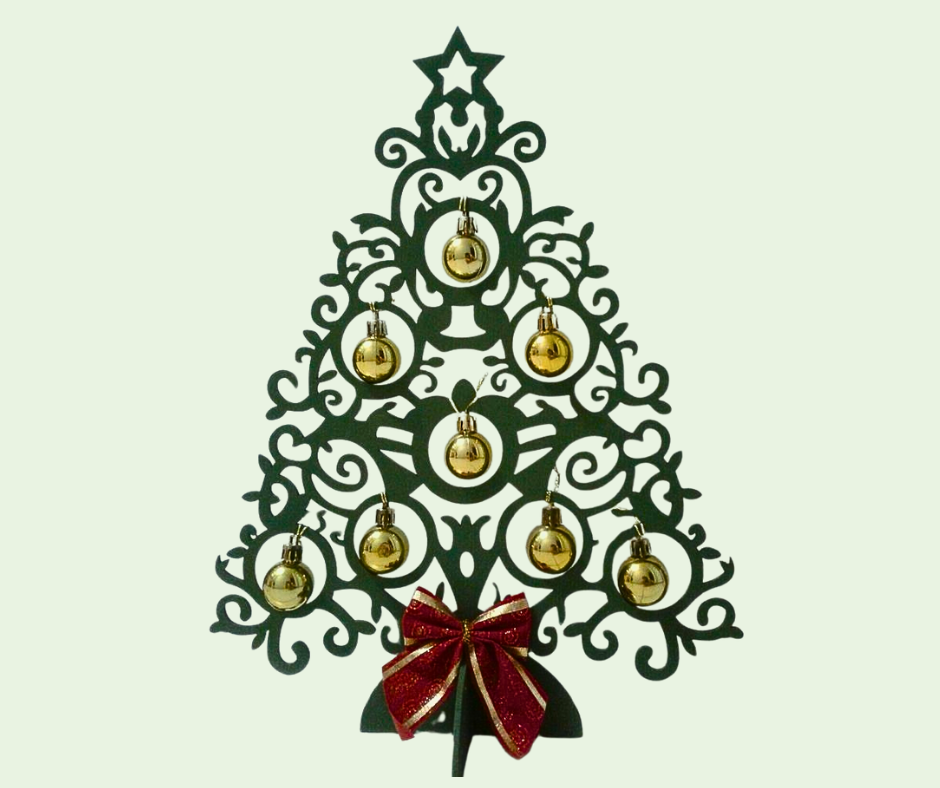 Decorative Christmas tree with gold ornaments and a red bow on a light green background