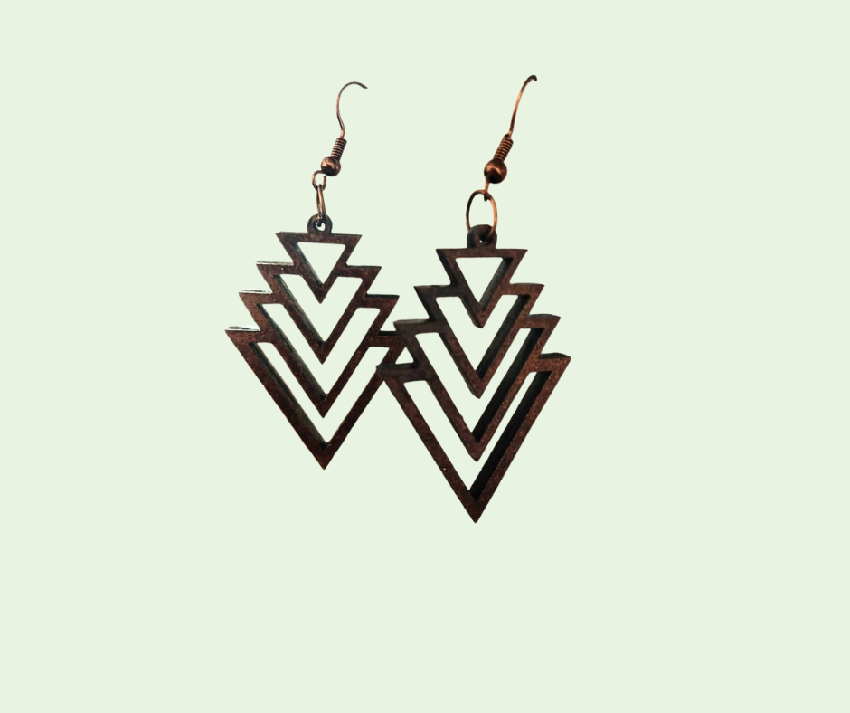 Pair of geometric earrings on a light green background