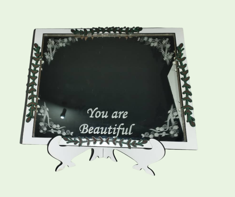 Decorative mirror with 'You are Beautiful' text on a light green background