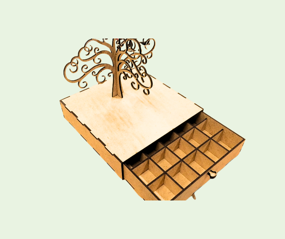 Wooden jewelry box with tree design on a light green background